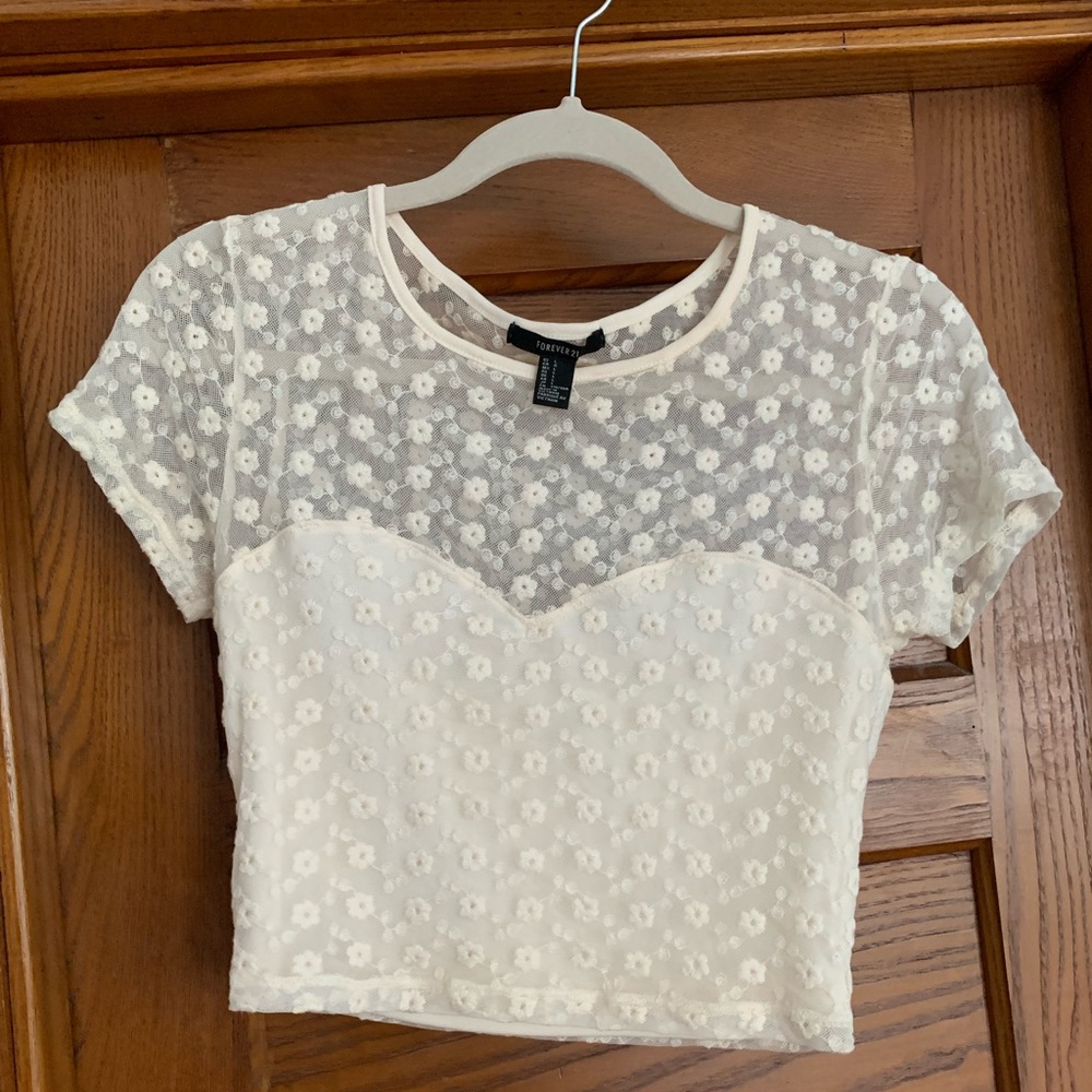 Forever 21 crop top. Cream colored with see through flower detail
